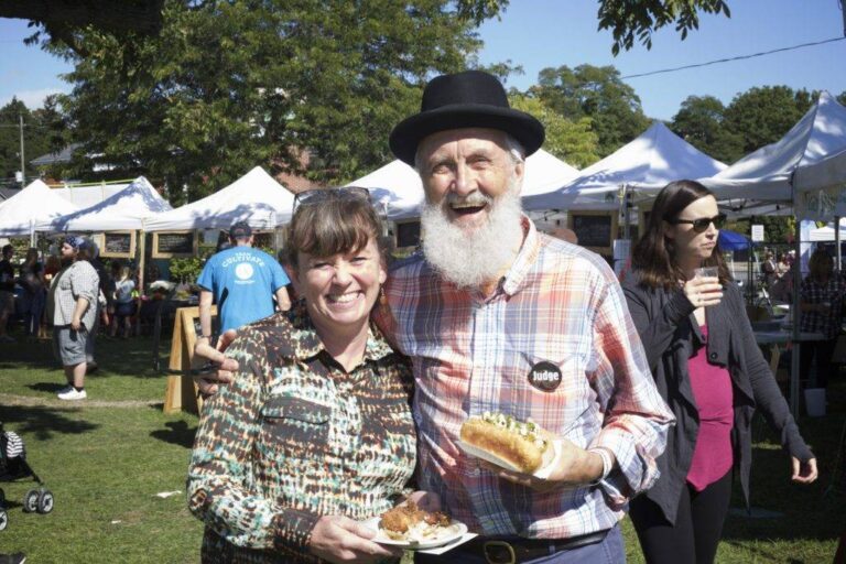 Fred Penner poses with a guest at the Cultivate Festival in Port Hope