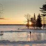 A kid skates on a frozen lake in the Kawarthas