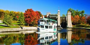 A small cruise boat sails out of the Peterborough Lift Lock