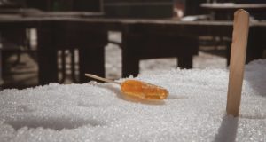 Maple syrup candy on a tray of clean snow