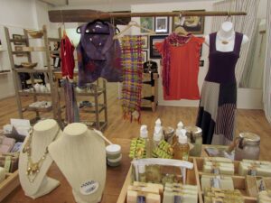 Selection of objects in artisans market, including jewelry and soap