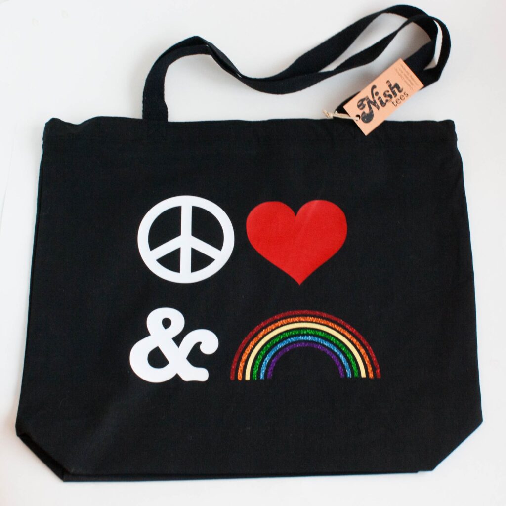 Tote by Nish Tees that reads "Peace Love and Rainbows"