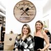 Steph Buckley and Holly Suddick stand at the counter of Rustically Signed