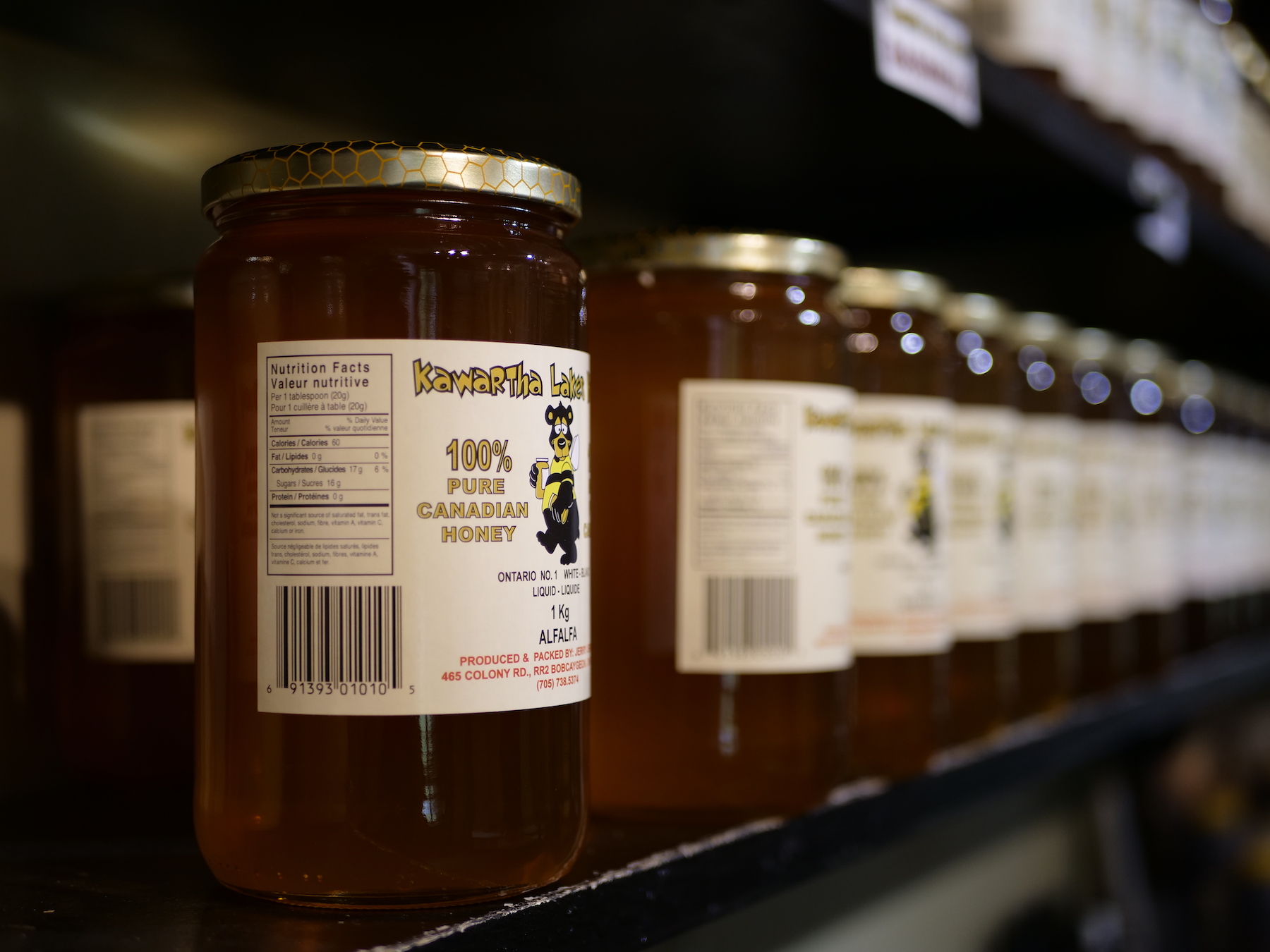 Jars of Kawartha Lakes Honey on a shelf