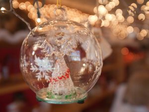 Closeup of a Christmas ornament containing a glass angel