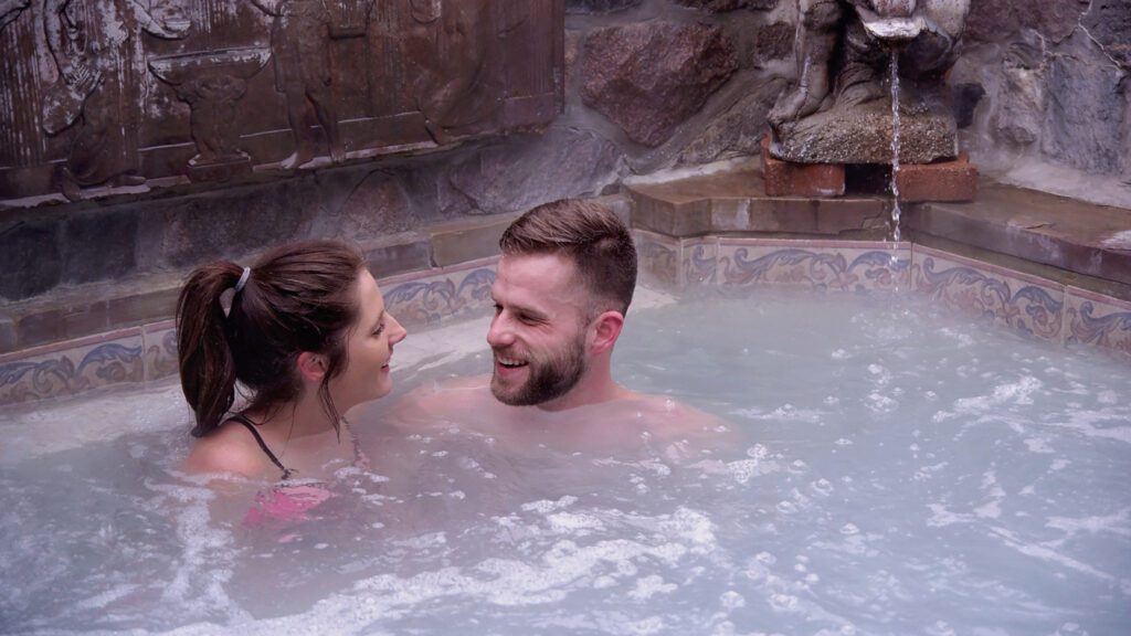 Two people in a hydrotherapy spa