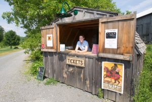 Outdoor ticket booth with receptionist inside at Westben