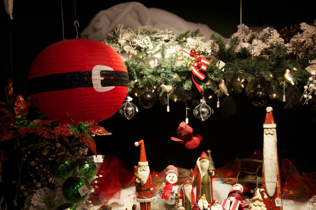 A variety of Santa Claus decorations against a dark background