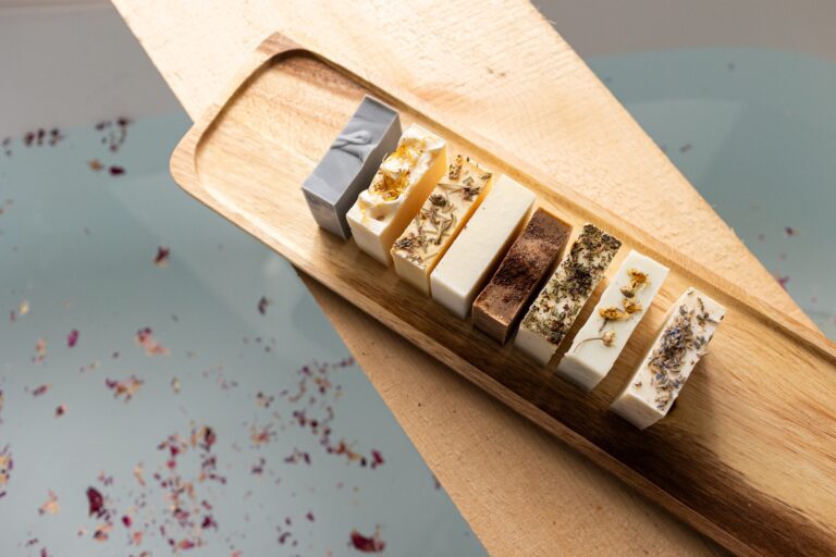 A selection of artisanal soaps on a wooden board