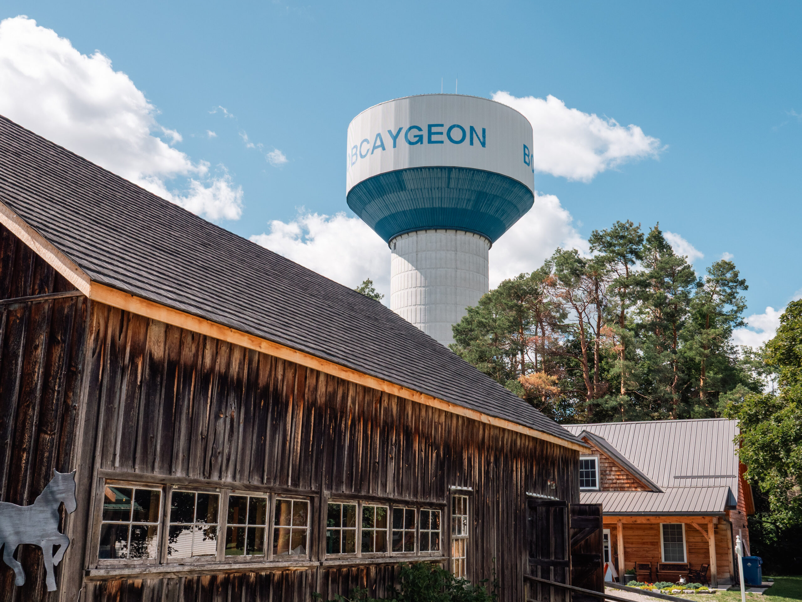 Bobcaygeon water tower, seen rising above a barn